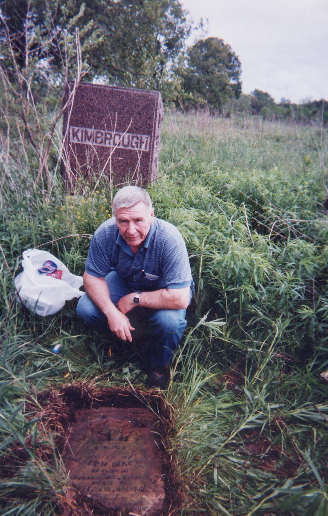 Jim Lewis with Jane Mapes stone found underground
